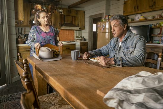 Maria (Adriana Barraza) and Rambo (Sylvester Stallone) In RAMBO: LAST BLOOD. Photo credit: Yana Blajeva
