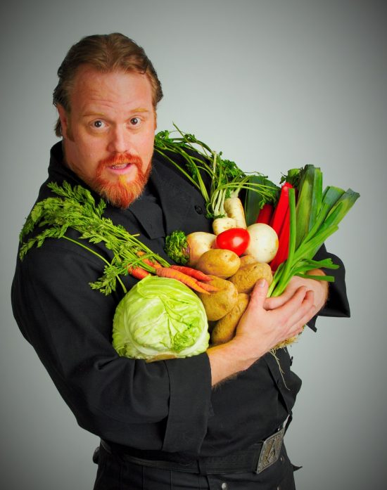 Chef McBride holding vegatables