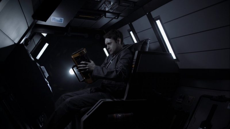 sas12 - Actor Garry Graham-Smith -playing Marcus Tyco- in the escape pod clasping the black box (frame grab)