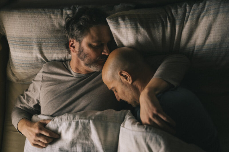 film Still - Colin Firth and Stanley Tucci