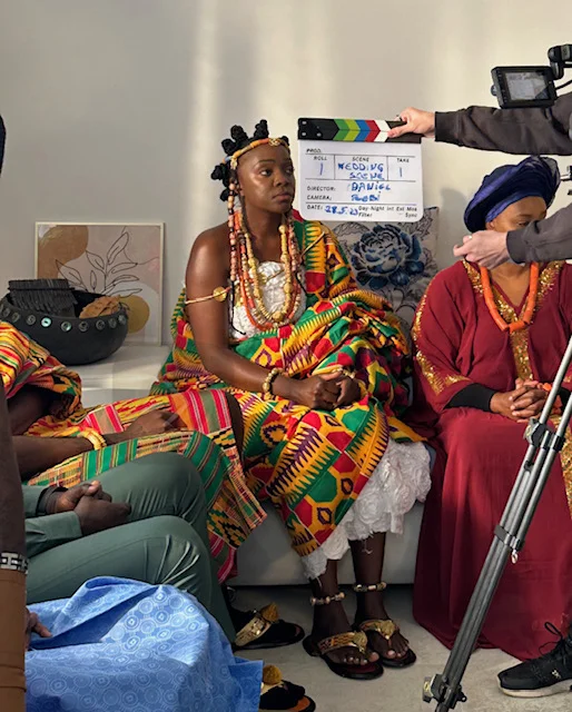 Suzan Mutesi on set filming